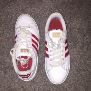 Women’s red & white adidas shoes.